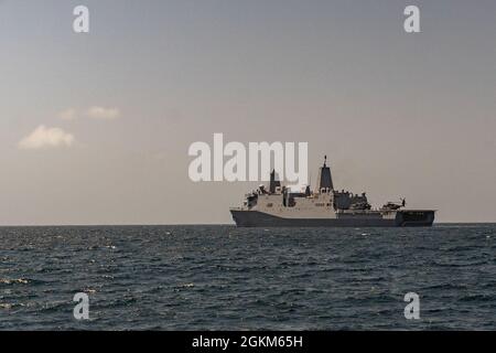 PACIFIC OCEAN (May 22, 2021) U.S. Navy amphibious transport dock USS Portland (LPD 27) sails in the Pacific Ocean, May 22. Marines and Sailors of the 11th Marine Expeditionary Unit (MEU) and Essex Amphibious Ready Group (ARG) are underway conducting integrated training off the coast of southern California. Stock Photo