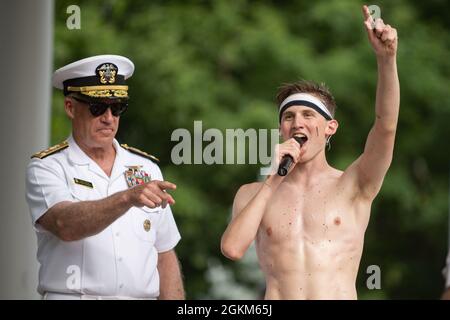 ANNAPOLIS, Md. (May 22, 2021) Midshipman 4th Class Michael Lancaster, 19, from Signal Mountain, Tenn., gives a speech after placing the midshipman cover atop the Herdon Monument. USNA freshmen, or plebes, climb the Herndon Monument, a tradition symbolizing the successful completion of the midshipmen's freshman year. The class of 2024 completed the climb in 3 hours and 41 minutes, the second-slowest recorded time. As the undergraduate college of our country's naval service, the Naval Academy prepares young men and women to become professional officers of competence, character, and compassion in Stock Photo