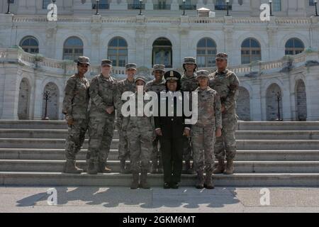 Yogananda D. Pittman, acting police chief, U.S. Capitol Police Department, poses in front of the U.S. Capitol Building with District of Columbia Army National Guard Joint Operations Center staff on the final day of National Guard operations in support of Capitol P.D., May 23, 2021. At the request of federal law enforcement agencies, the National Guard provided security, communications, medical evacuation, logistics and safety support to state, district and federal agencies. Stock Photo