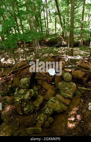 Defenders assigned to the 910th Security Forces Squadron load a litter ...