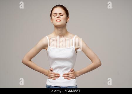 woman groin pain intimate illness gynecology light background