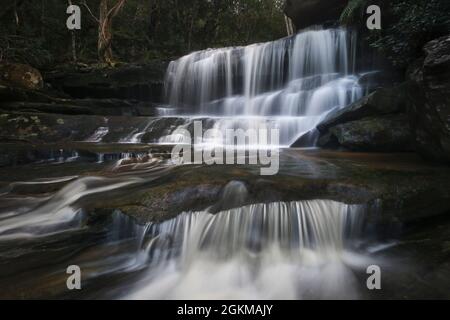 tiers of falling water at somersby falls on nsw central coast Stock Photo