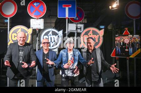 Berlin, Germany. 14th Sep, 2021. The musicians Manfred Hennig (l-r), Toni Krahl, Fritz Puppel and Georgi Gogow from the band City at a press event for the 50th anniversary in 2022. The band wants to say goodbye to their fans with several live concerts at the end of next year. A new double album and a book are planned for the anniversary year. Credit: Jens Kalaene/dpa-Zentralbild/dpa/Alamy Live News Stock Photo