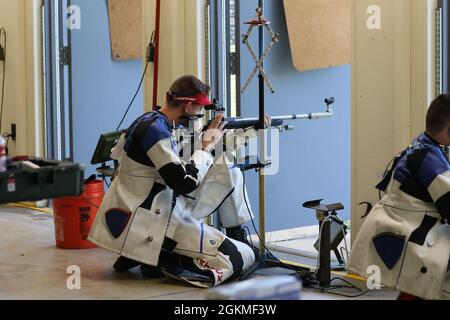 Sgt. Patrick Sunderman, a Farmington, Minnesota native who is a marksmanship instructor/competitive shooter for the U.S. Army Marksmanship Unit, earned a spot on Team USA's Men's 50m Smallbore Team after completing Part 2 of the Olympic Trials at Fort Benning, Georgia on May 26, 2021.     This Soldier claimed his Olympic berth with the combined score (from Part 1 and Part 2 Trials) of 4706-249x. The 50m Smallbore event is also referred to as Three Position rifle since the athletes must fire 40 rounds in the kneeling, prone and standing positions in two days of qualification rounds. Then, the t Stock Photo