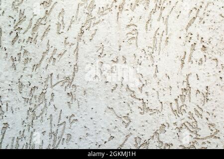 Empty dirty cracked white concrete wall texture or background Stock Photo