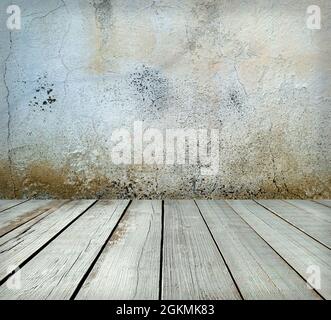 Room interior: grey old cracked painted cement wall texture with wooden floor Stock Photo