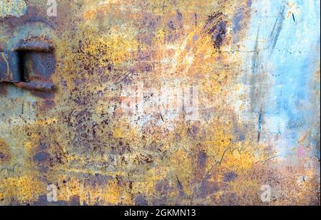 Rusty colored metal texture with cracked paint, grunge background Stock Photo
