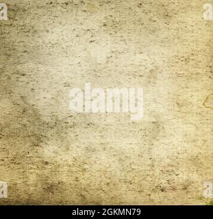 Aged dirty beige brown paper canvas grunge background or texture. Closeup Stock Photo