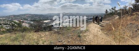 U.S. Army Corps of Engineers South Pacific Division commander Brig. Gen. Paul Owen and the Corps' Los Angeles District team led by Col. Julie Balten have a panoramic view of the Los Angeles River from Elysium Park, May 26, 2021, during a visit to the District. Stock Photo