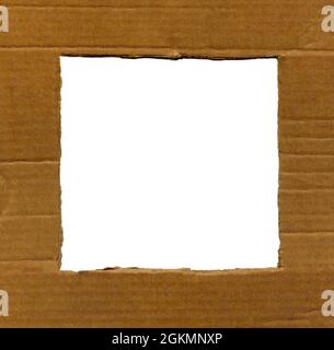Textured cardboard frame with rough torn edges isolated over white Stock Photo