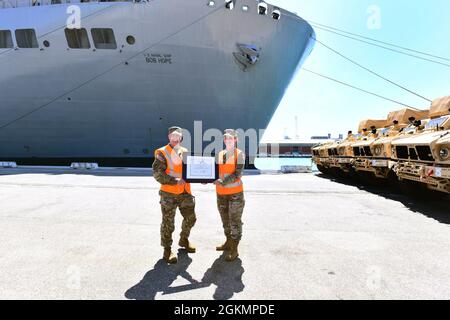 The 839th Transportation Battalion 'Key to the Mediterranean 'held a Family Day event at the port facility in Livorno, Italy, May 28, 2021. The 839th along with the members of its Italy Detachment invited family members to the port to observe port operations in support of the equipment upload to the USNS Bob Hope, a U.S. Military Sealift Command vessel. The families were able to see first-hand the vital mission that 839th Soldiers, Army civilians and host-nation professionals perform at ports in support of the U.S. European Command and U.S. Africa Command missions. Stock Photo