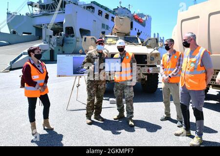 The 839th Transportation Battalion 'Key to the Mediterranean 'held a Family Day event at the port facility in Livorno, Italy, May 28, 2021. The 839th along with the members of its Italy Detachment invited family members to the port to observe port operations in support of the equipment upload to the USNS Bob Hope, a U.S. Military Sealift Command vessel. The families were able to see first-hand the vital mission that 839th Soldiers, Army civilians and host-nation professionals perform at ports in support of the U.S. European Command and U.S. Africa Command missions. Stock Photo