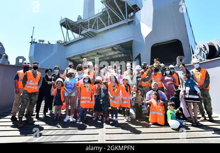 The 839th Transportation Battalion 'Key to the Mediterranean 'held a Family Day event at the port facility in Livorno, Italy, May 28, 2021. The 839th along with the members of its Italy Detachment invited family members to the port to observe port operations in support of the equipment upload to the USNS Bob Hope, a U.S. Military Sealift Command vessel. The families were able to see first-hand the vital mission that 839th Soldiers, Army civilians and host-nation professionals perform at ports in support of the U.S. European Command and U.S. Africa Command missions. Stock Photo