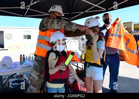 The 839th Transportation Battalion 'Key to the Mediterranean 'held a Family Day event at the port facility in Livorno, Italy, May 28, 2021. The 839th along with the members of its Italy Detachment invited family members to the port to observe port operations in support of the equipment upload to the USNS Bob Hope, a U.S. Military Sealift Command vessel. The families were able to see first-hand the vital mission that 839th Soldiers, Army civilians and host-nation professionals perform at ports in support of the U.S. European Command and U.S. Africa Command missions. Stock Photo