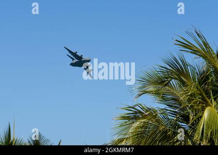 A C-17 Globemaster III, piloted by members of the C-17 West Coast Demo Team from Joint Base Lewis-McChord, Washington, flies through the skies above Miami Beach, Florida, May 29, 2021. The demonstration was a part of the National Salute to Our Heroes Hyundai Air and Sea Show, which had over 100,000 viewers both days of the show. Stock Photo