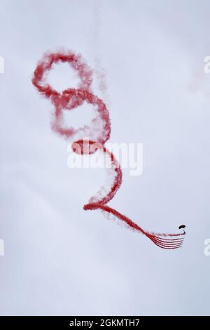A member of the British Army Red Devils Army Display Team conducts an aerial demonstration above Miami Beach, Florida, after parachuting out of a C-17 Globemaster III piloted by the C-17 West Coast Demo Team from Joint Base Lewis-McChord, Washington, May 30, 2021. The air drop and parachuting demonstration was a part of the National Salute to Our Heroes Hyundai Air and Sea Show, which had over 100,000 viewers both days of the show. Stock Photo