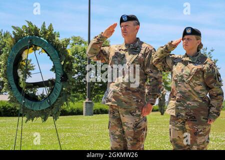 This Memorial Day, 101st Airborne Division (Air Assault) take time to remember those who made the ultimate sacrifice in a wreath laying ceremony.     In this ceremony 101st Airborne Division (Air Assault) command team, Maj. Gen. JP McGee and Command Sgt. Maj. Veronica Knapp honor the fallen U.S. military heroes who gave the ultimate sacrifice in duty to our nation by laying a wreath in front of the division's eternal flame. Stock Photo