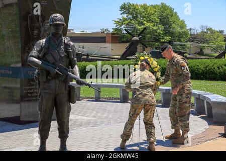 This Memorial Day, 101st Airborne Division (Air Assault) take time to remember those who made the ultimate sacrifice in a wreath laying ceremony.     In this ceremony 101st Airborne Division (Air Assault) command team, Maj. Gen. JP McGee and Command Sgt. Maj. Veronica Knapp honor the fallen U.S. military heroes who gave the ultimate sacrifice in duty to our nation by laying a wreath in front of the division's eternal flame. Stock Photo