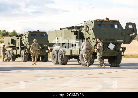 BEZMER AIR BASE, Bulgaria — A U.S. Army M142 High Mobility Artillery Rocket System assigned to 1st Battalion, 77 Field Artillery Regiment, 41st Field Artillery Brigade, prepares to return inside a C-17 Globemaster III transport aircraft with the help of the Tennessee Air National Guard after the HIMARS Rapid Infiltration, a live-fire exercise in support of Saber Guardian at Bezmer Air Base, June 1st, 2021. Saber Guardian 21 is a linked exercise of DEFENDER-Europe 21. DEFENDER-Europe 21 is a large-scale U.S. Army-led exercise designed to build readiness and interoperability between the U.S., NA Stock Photo