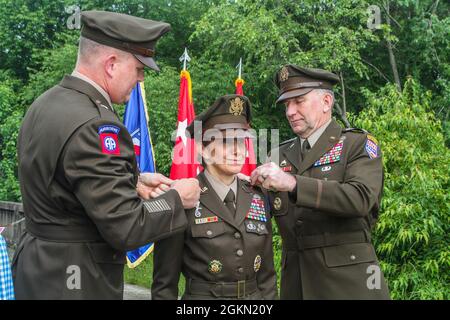 Brig. Gen. Trevor J. Bredenkamp, Deputy Commanding General of Operations for Eighth Army (left), and Gen. Robert B. Abrams, Commander of United States Forces Korea (right), pin the two-star rank on Maj. Gen. Michele H. Bredenkamp, United States Forces Korea Director of Intelligence, during her promotion ceremony at the Joint Security Area, South Korea, June 2, 2021. Bredenkamp has served as an Intelligence Officer since 1990 in a variety of positions such as brigade commander and Defense Intelligence Agency Vice Director for Intelligence, with various deployments to Afghanistan and Iraq. Stock Photo