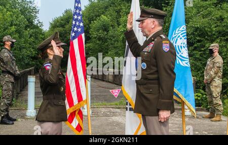 Maj. Gen. Michele H. Bredenkamp, United States Forces Korea Director of Intelligence, receives the Oath of Office from Gen. Robert B. Abrams, Commander of U.S. Forces Korea at the Bridge of No Return, Joint Security Area, South Korea, June 2, 2021. Bredenkamp has served as an Intelligence Officer since 1990 in a variety of positions such as brigade commander and Defense Intelligence Agency Vice Director for Intelligence, with various deployments to Afghanistan and Iraq. Stock Photo