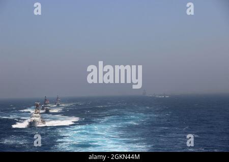 The coastal patrol ships USS Thunderbolt (PC 12) and USS Squall (PC 7 ...