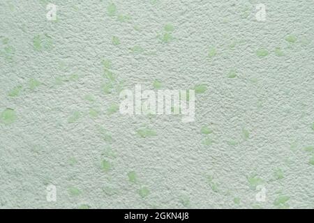 Light and dark green decorative texture. The texture of liquid Wallpaper to cover the walls. Stock Photo