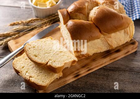 Braided egg bread on wooden table Stock Photo
