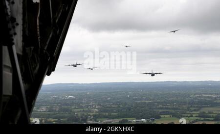 C-130J Super Hercules aircraft from the 37th Airlift Squadron fly in formation in French airspace June 6, 2021. The formation flight flew over several ceremonies to commemorate the 77th anniversary of D-Day. Stock Photo