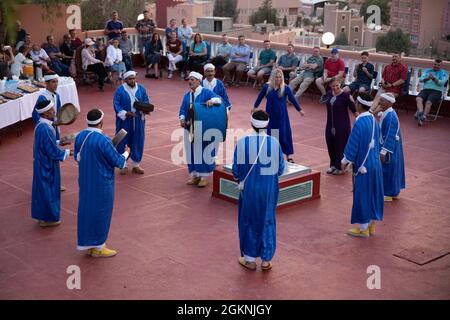 Moroccan dancers perform traditional Berber folk music during a welcome ceremony in Tafraoute, Morocco, for service members on June 6, 2021. African Lion 2021 is U.S. Africa Command's largest, premier, joint, annual exercise hosted by Morocco, Tunisia, and Senegal, 7-18 June. More than 7,000 participants from nine nations and NATO train together with a focus on enhancing readiness for U.S. and partner nation forces. AL21 is multi-domain, multi-component, and multinational exercise, which employs a full array of mission capabilities with the goal to strengthen interoperability among participant Stock Photo