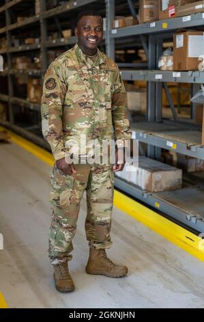 Staff Sergeant Salem Dogbe, a member of the Alaska Air National Guard, is a part of the Individual Equipment Element, Logistics Readiness Squadron, 168th Wing, Eielson Air Force Base, Alaska, June 6th, 2021. SSgt Dogbe and LRS are tasked with ensuring the Airmen of the 168th Wing are supplied with the equipment and clothing they require for mission success, especially in the arctic environment of Alaska. Stock Photo