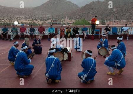 Moroccan dancers perform traditional Berber folk music during a welcome ceremony in Tafraoute, Morocco for service members on June 6, 2021. African Lion 2021 is U.S. Africa Command’s largest, premier, joint, annual exercise hosted by Morocco, Tunisia, and Senegal, 7-18 June. More than 7,000 participants from nine nations and NATO train together with a focus on enhancing readiness for us and partner nation forces. AL21 is multi-domain, null-component, and multinational exercise, which employs a full array of mission capabilities with the goal to strengthen interoperability among participants. Stock Photo