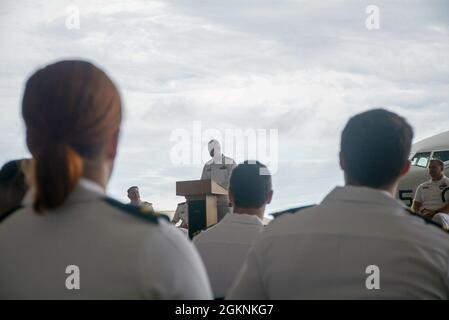 210607-N-SR472-0002 KADENA AIR BASE, Japan (June 7, 2021)  Commander Charles A. Larwood III speaks to the Sailors of Patrol Squadron (VP) FOUR FIVE during a Change of Command ceremony on Kadena Air Base June 7. CDR Larwood was relieved by Commander Seth R. Eisenmenger as the Commanding Officer of VP-45. Stock Photo