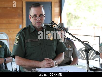 Big Bend Sector Chief Sean McGoffin speaks to ranchers and concerned citizens from the region during a community meeting at Ft. Davis, Texas, June 7, 2021. McGoffin was joined by multiple Border Agents in Charge of stations from Van Horn, Sierra Blanca, Alpine and Marfa along with the senior Texas Department of Public Safety officer for the region, the senior ranking Texas Game Warden, local sheriff's and judges. Stock Photo