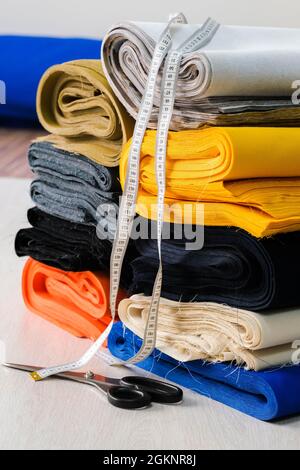 Colorful cotton fabric. A lot of cotton fabric for sewing clothes or  bedding. Natural cloth and tailoring. Stock Photo