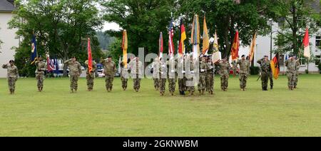 U.S. Army officers and colors with the 21st Theater Sustainment Command render honors during the 21st TSC change of command ceremony, June 8, 2021 at Daenner Kaserne, Kaiserslautern, Germany. Brig. Gen. James M. Smith assumed command of the unit from Maj. Gen. Christopher Mohan. Stock Photo