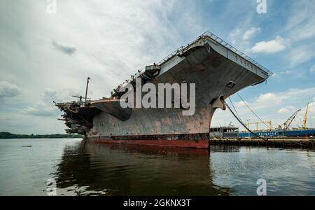 PHILADELPHIA, PA (June 9, 2021) Decommissioned ship USS John F. Kennedy CVA 67 currently moored at the Philadelphia Navy Yard. Sailors from CVN 79 are touring and documenting spaces and deployment artwork aboard to preserve the history and heritage of the JFK legacy. Stock Photo