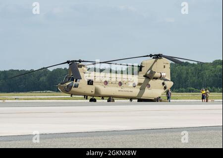 A CH-47F Chinook helicopter sits on the flight line at Dover Air Force Base, Delaware, June 8, 2021. A Boeing Defence Australia maintenance team prepared two Chinooks for shipment aboard a C-5M Super Galaxy to Royal Australian Air Force Base Townsville, Australia, as part of the U.S. government’s foreign military sales program. The U.S.-Australia alliance is an anchor for peace and stability in the Indo-Pacific region and around the world. Stock Photo