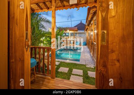 living room with pool view in wooden house Stock Photo