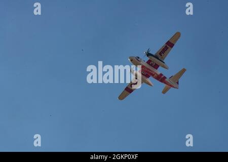 A Cal Fire S-2T Airtanker prepares for an aerial fire retardant drop to ...