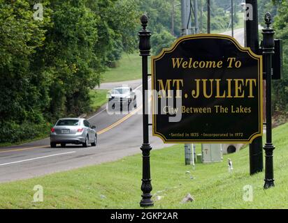 Vehicles pass a 'Welcome to Mt. Juliet' sign on Old Lebanon Dirt Road near Global Vision Bible Church on Sunday, Aug. 1, 2021 in Mount Juliet, Wilson County, TN, USA. Controversial church Pastor Greg Locke has drawn international attention to Mount Juliet, a suburban community of less than 40,000 people located approximately 17 miles east of downtown Nashville, by banning church attendees from wearing masks amid the COVID-19 pandemic and saying anyone wearing a mask to his church will be asked to leave. (Apex MediaWire Photo by Billy Suratt) Stock Photo