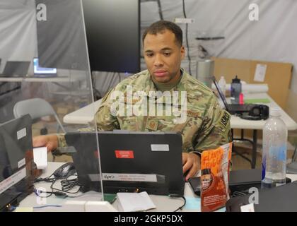 A U.S. Air Force master sergeant. works at his computer during the Defender Europe 21 command post exercise, June 10, 2021, on Fort Knox Kentucky. The CPX was another step in the Victory Corps march to full operational capability and becoming a certified warfighting headquarters. Stock Photo