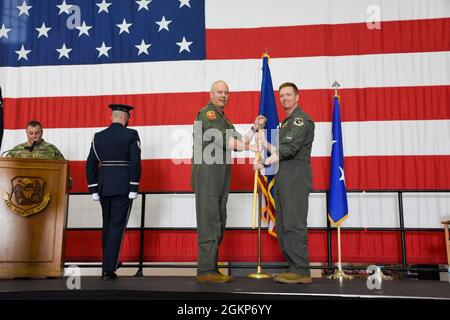 Maj. Gen. Brian Borgen, left, a former commander of the 442d Fighter Wing, officiates the general officer flag unfurling ceremony to mark the promotion of Brig. Gen. Mike Schultz, the current 442 FW commander, June 11, 2021, in the 5-Bay hangar on Whiteman Air Force Base, Mo. Schultz served under Borgen as the commander of the 476th Fighter Group at Moody Air Force Base when Borgen led the 442 FW, and again as 442 FW commander when Borgen helmed 10th Air Force. Stock Photo