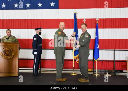 Maj. Gen. Brian Borgen, left, a former commander of the 442d Fighter Wing, officiates the general officer flag unfurling ceremony to mark the promotion of Brig. Gen. Mike Schultz, the current 442 FW commander, June 11, 2021, in the 5-Bay hangar on Whiteman Air Force Base, Mo. Schultz served under Borgen as the commander of the 476th Fighter Group at Moody Air Force Base when Borgen led the 442 FW, and again as 442 FW commander when Borgen helmed 10th Air Force. Stock Photo