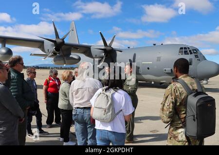 Employers of Soldiers and Airmen, and Employer Support of the Guard and Reserve representatives are briefed by Maj. Matthew Redmond, public affairs officer, Air National Guard 129th Rescue Wing out of Mountain View, Calif., in preparation to get on a Calif. Army National Guard, 129th Air Guard C-130, June 12, 2021, as part of the ESGR Boss Lift program. Stock Photo