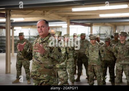 Maj. Gen. José Reyes, the adjutant general, Puerto Rico National Guard, conducts an after action review with Soldiers of the 191st Regional Support Group, PRNG, during his visit at the National Training Center, Fort Irwin, California, June 14, 2021. Reyes visited Soldiers of the 191st RSG supporting the 155th Armored Brigade Combat Team, Mississippi Army National Guard, during their training rotation at NTC. Stock Photo