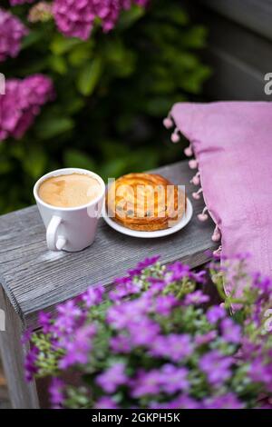 Coffee with cake in the garden Stock Photo