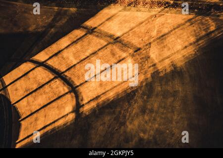 shadows from the lattice in a mysterious corridor in the old room Stock Photo