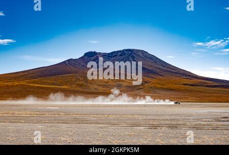 Car riding among Bolivian desert Stock Photo