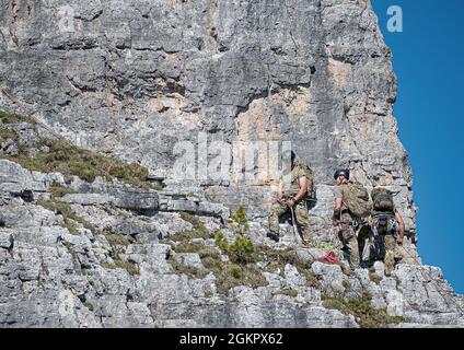 U.S. Army paratroopers assigned to the 173rd Airborne Brigade climb Cinque Torri as part of a mountain warfare training with the 6th Alpini Regiment in the Dolomites mountains, Italy on June 15, 2021.     The paratroopers learn survival and trekking skills in an austere environment as part of a series of planned training events to enhance readiness and build allied interoperability between U.S. and Italian forces.
